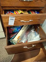 Drawer view showing multiple boxed wraps and bags