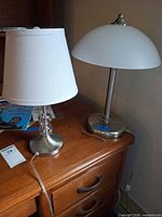 Both table lamps side by side on desk showing size and design