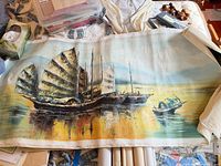 Full view of rolled canvas painting with boats