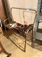Full view of vintage metal rolling cart with two shelves