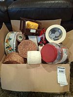 Box overview showing assorted sewing supplies, storage containers and notions