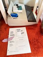 Top view of typewriter with manual in foreground