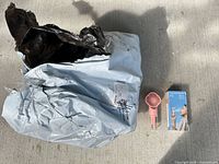 Sealed shipping bag, one unboxed pink fan, one boxed unit