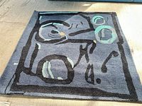 Full view of square CB2 abstract rug laying flat