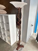Full view of floor lamp showing height, shade, and twisted metal body
