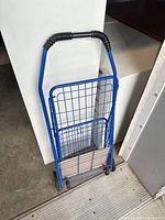 Cart folded flat against wall