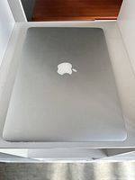 Top view of closed silver MacBook Air showing Apple logo