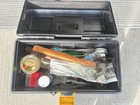 Open toolbox displaying all included hand tools and accessories