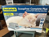 Front of retail box showing brand, model and cat image