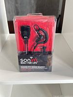 Front of sealed Sonim Rugged PTT Wired Headset retail package