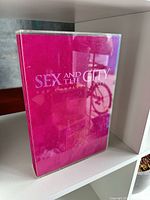 Front view of pink slipcase showing title Sex and the City The Complete Series