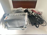 Sony Handycam Hi8 camcorder with cables, adapter, and remote