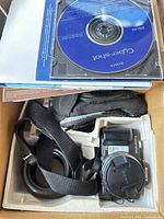 Camera, software CD and accessories in molded packaging