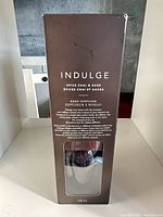 Front view of boxed Indulge Spice Chai & Sage reed diffuser showing branding and scent details