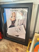 Framed Sugarland promotional photo with signed silver tie