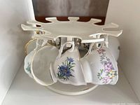 Top view of rotating stand with teacups hanging