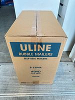 Front view of sealed Uline Bubble Mailers case showing model, size and quantity