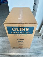 Cardboard case labeled Uline Bubble Mailers S-13944 #DVD 7-1/4" x 10-1/2" 100/Case