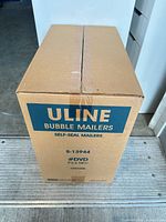Front of sealed Uline box showing product details (Bubble Mailers, #DVD, 7.5" x 10.5", 100/case)