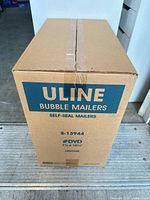 Front view of sealed Uline Bubble Mailers case displaying model, size and count