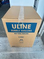 Front view of sealed Uline Bubble Mailers case showing product details