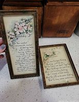 Both framed motto prints front view