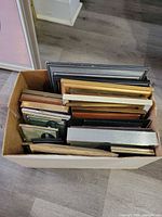 top view of box containing multiple frames in various finishes