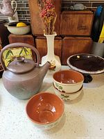 All six ceramic pieces grouped on countertop