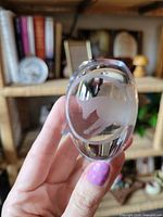 Front view showing frosted bull inside clear crystal oval