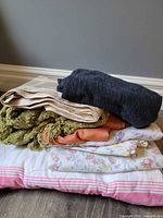 Stack of all six textiles showing colors and variety