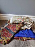 Stacked fabrics showing three different patterns and colors