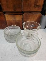 Group shot of all clear glass bowls and compote