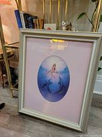 Full framed print on floor showing frame, mat and art