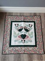 Front view of entire quilt showing applique design, borders and colors