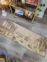 Full view of cotton scenic tapestry on floor