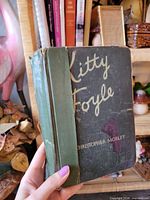 Front cover showing title, author, cloth spine, visible wear