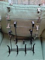 All three items: pant clip hanger at back, two black hook racks front