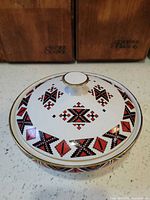 Top view of covered candy dish showing geometric pattern and gold trim