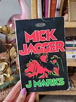 Front cover of paperback showing title, author, publisher logo and wear