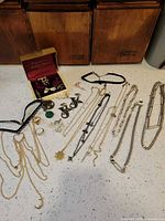 Overall view showing necklaces, rings, earrings, Bulova box