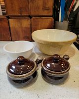 All four pottery pieces grouped together