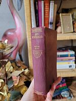 Front view of maroon cloth hardcover showing spine title "Les Misérables" and Collins imprint