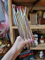 Four silver faux taper candles held together showing length and finish