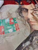 Close view of Circus #15 Alice Cooper snake poster showing autograph and water damage