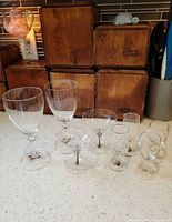 Group view of all eight clear glass pieces