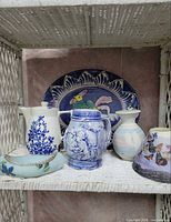 Group shot showing serving platter, coffee carafe, pitcher, mug, canoe ring dish