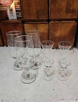 Group of six etched glasses showing sizes