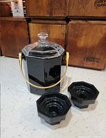 Ice bucket with lid and two candlesticks front view