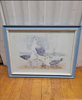 Front view of framed seagull picture showing artwork and frame