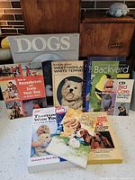 Group of pet care paperback books displayed